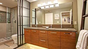 remodeled bathroom has bamboo cabinetry