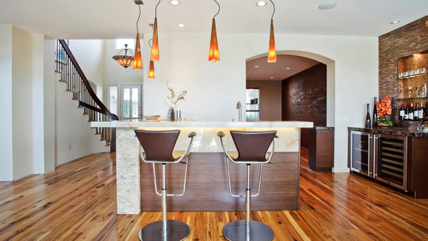 contemporary bar made of horizontal bamboo and a slab of vanilla onyx